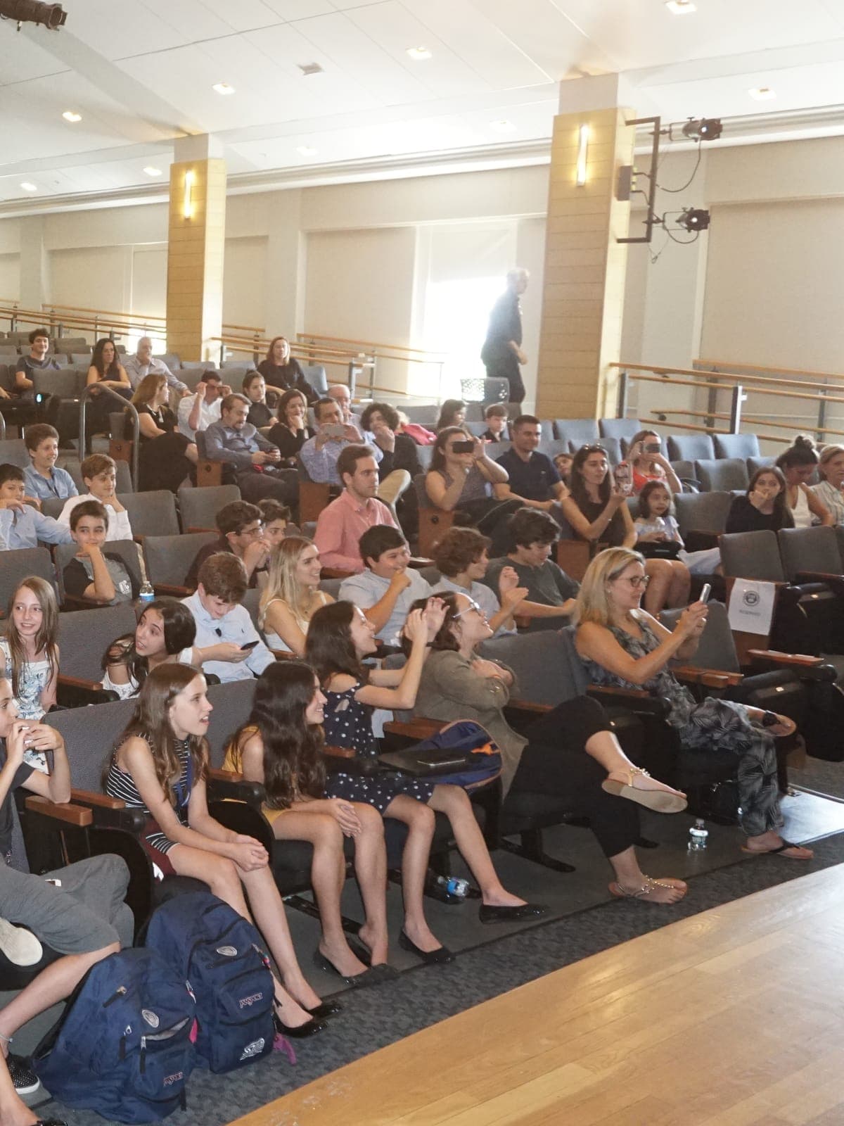 Closing Ceremony audience, with participants and families in the auditorium.