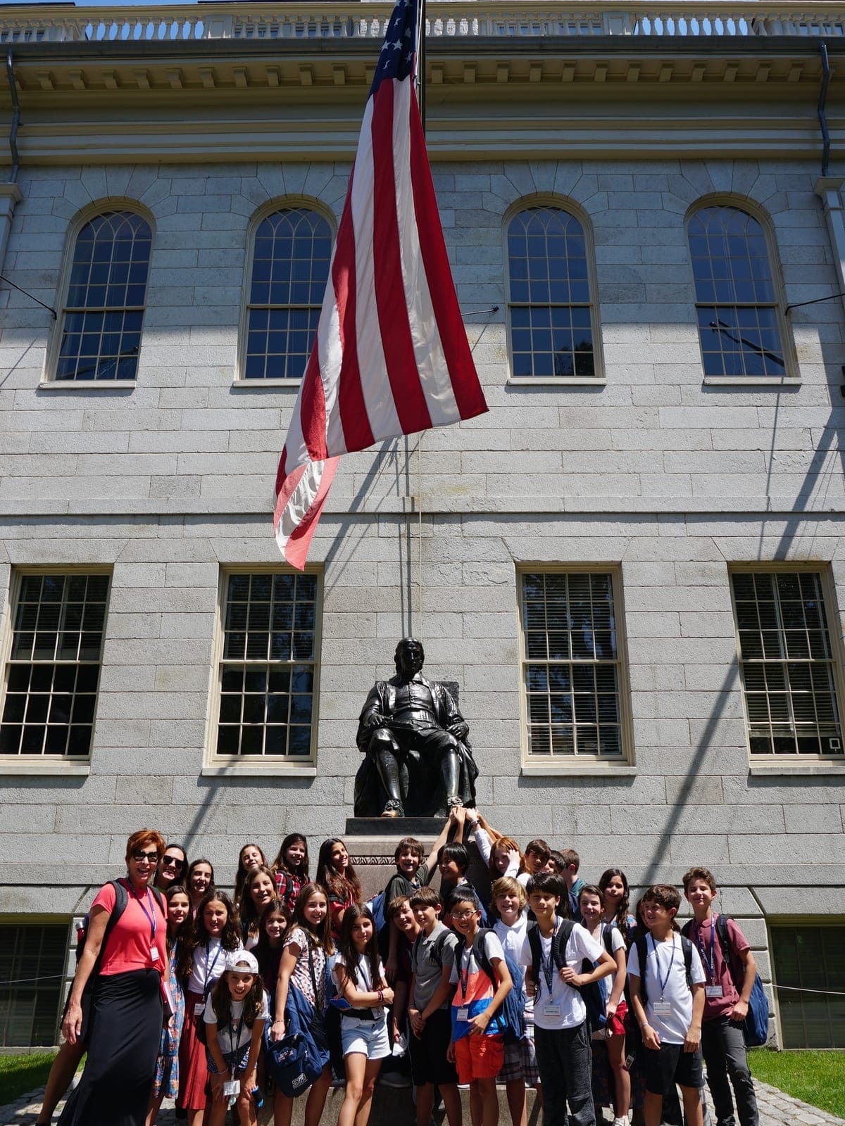 BCI cohort gathered on the University Hall steps in Harvard Yard, under the American flag.