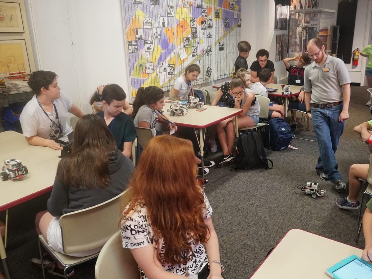 Class watching the robot run on the classroom floor during the session.