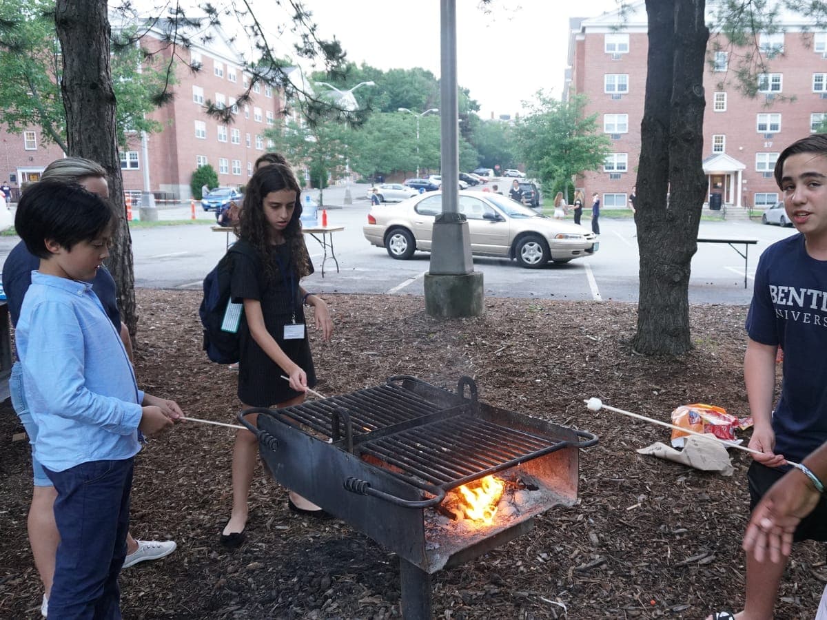 Participants and BCI staff around the campus fire pit in the early evening.